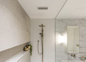 The Compact Linear Bar Grille sits discreetly over the shower, part of the ventilation system at Montefiore Aged Care