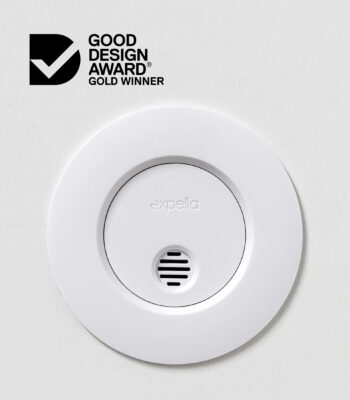 Expella's Ceiling Mounted Humidity Sensor photographed close up on a white ceiling with the Good Design Award Best in Class logo
