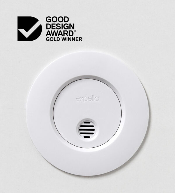 Expella's Ceiling Mounted Humidity Sensor photographed close up on a white ceiling with the Good Design Award Best in Class logo