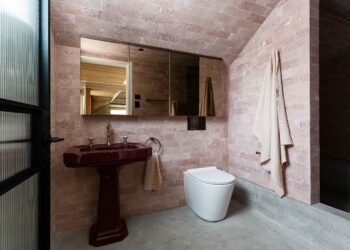 Loft bathroom in Alexander House featuring Expella's Milu Odourless toilet and pink marble Rosso Cream Tiles